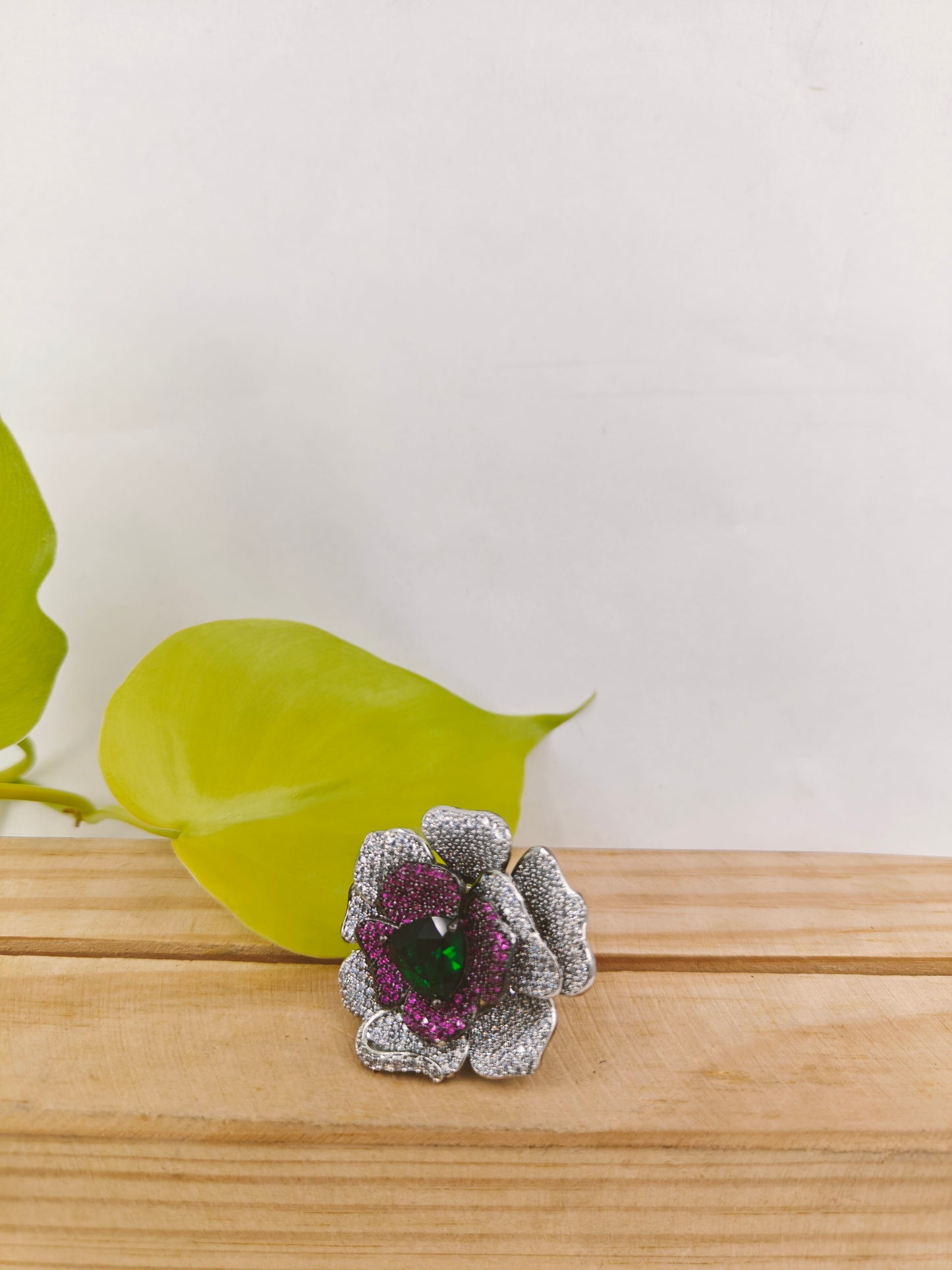 Platinum finish ring with nano stones in amythist and platinum colour in a flower design