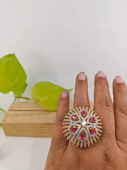 Gold and platinum finish dome shaped ring highlighted with ruby pink stones and CZ