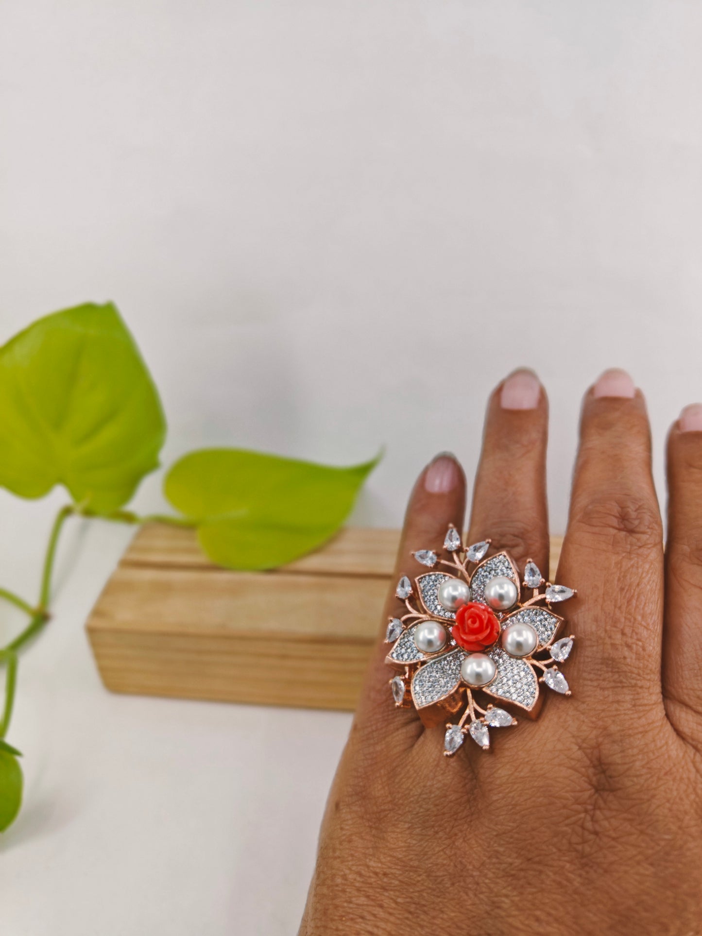 Rose gold finish ring,flower design,pearls and peach stone rose in centre