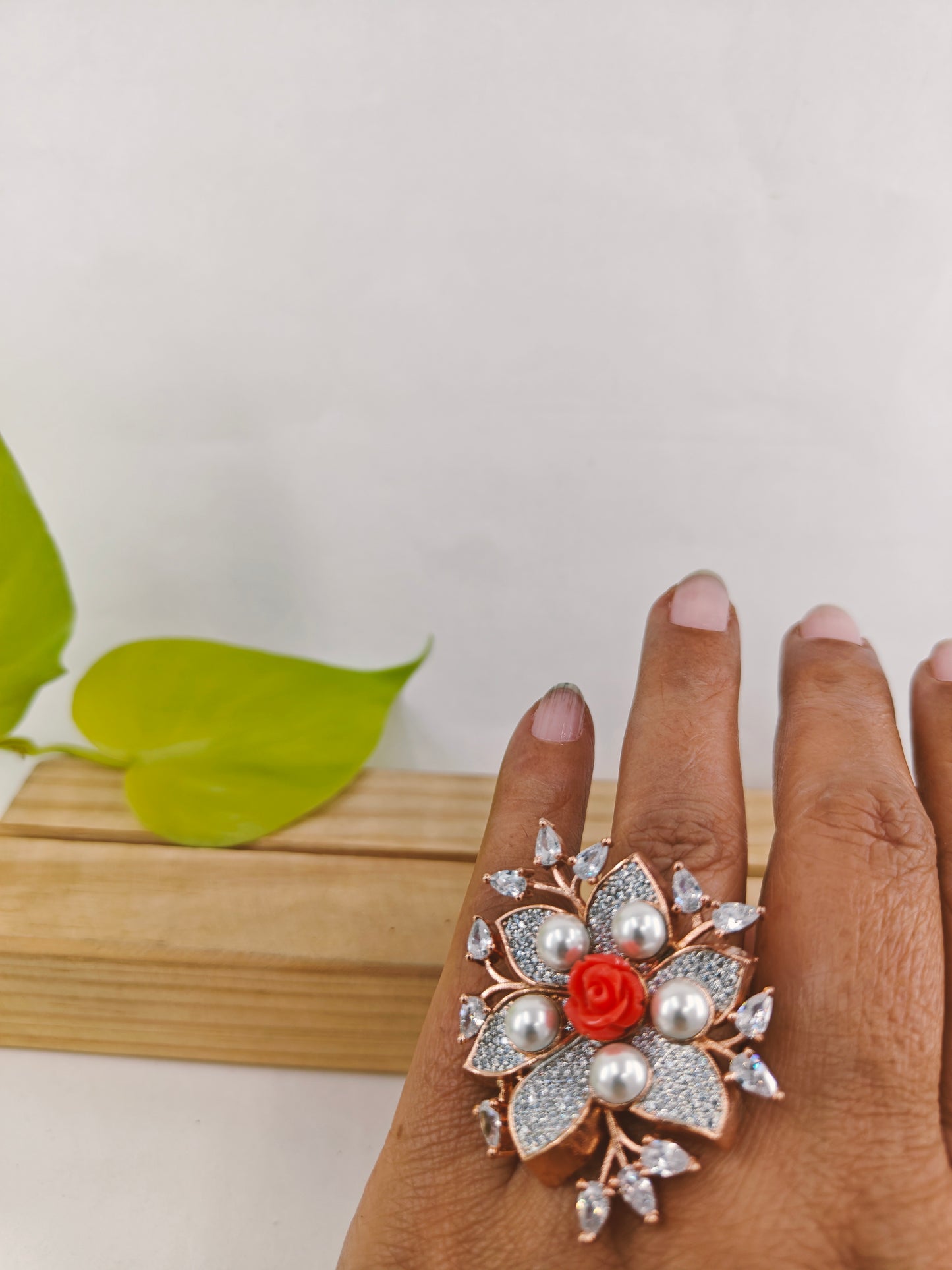 Rose gold finish ring,flower design,pearls and peach stone rose in centre