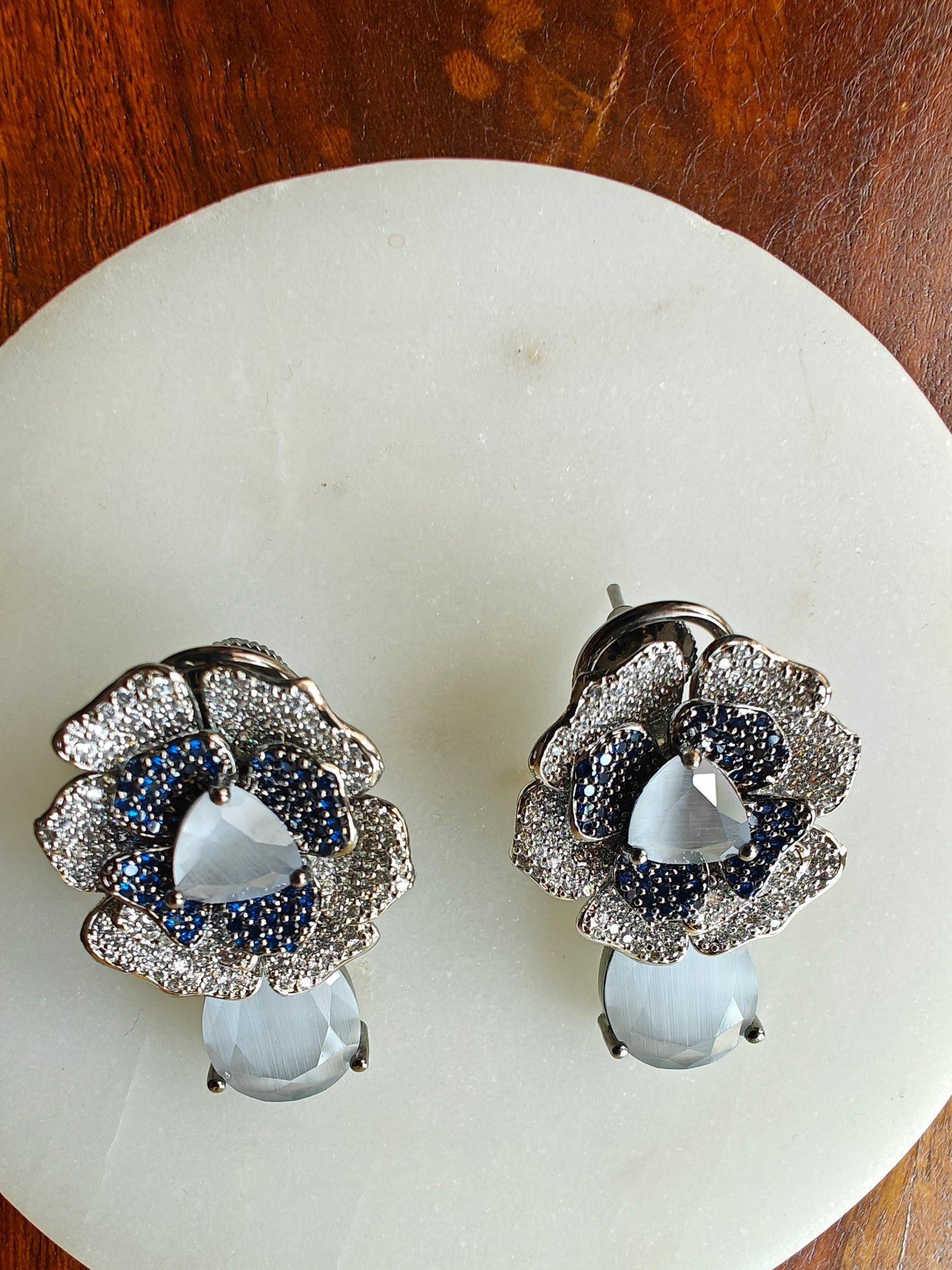 Open flower earrings with aquamarine-green/grey-blue nano stones with CZ highlights