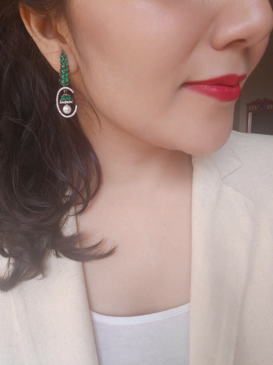 Leaf green twig earrings with a bell hanging