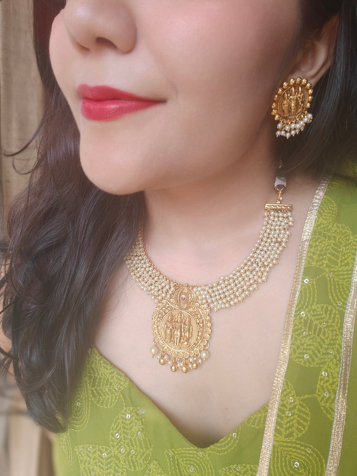 Gold temple jewelry,a Ram darbar pendant on pearl clusters