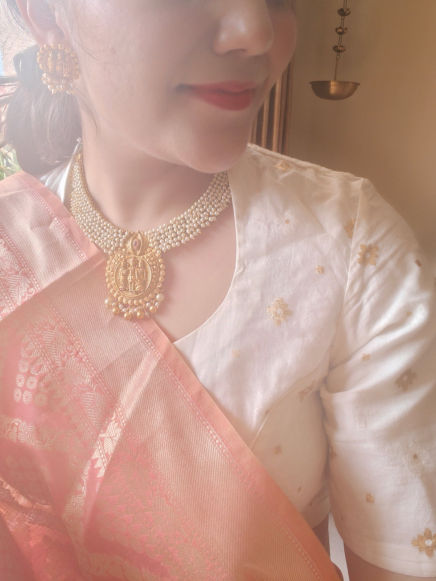 Gold temple jewelry,a Ram darbar pendant on pearl clusters