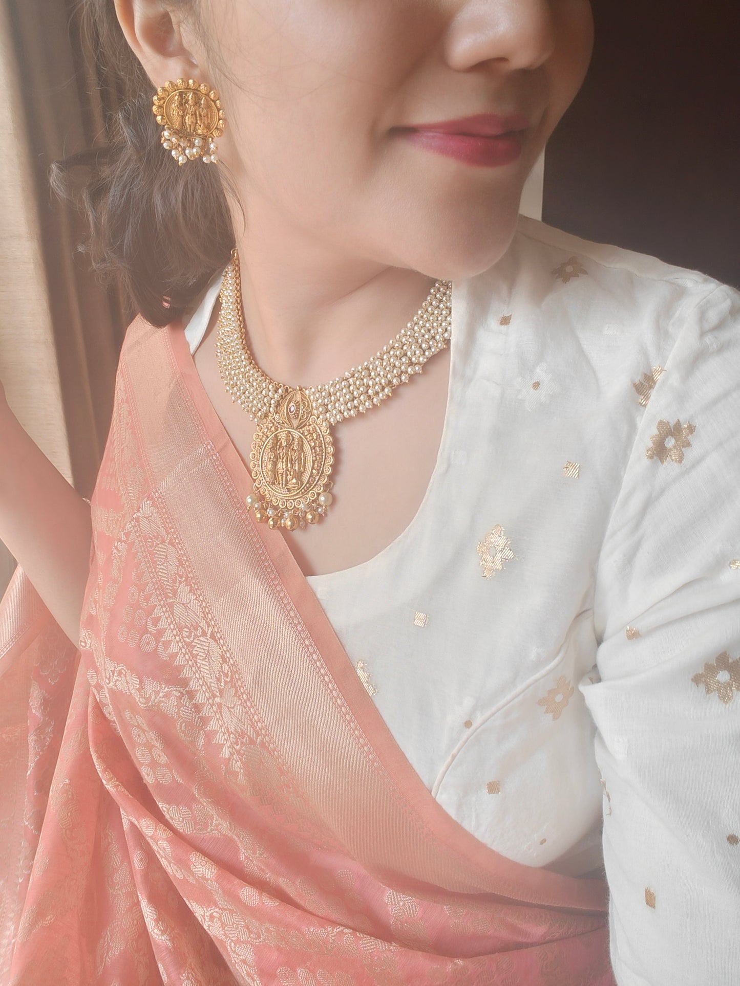 Gold temple jewelry,a Ram darbar pendant on pearl clusters