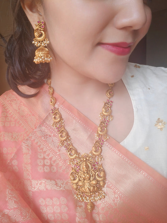 Padmavati Temple set in a gold finish with a Lakshmi pendant, peacock motif all around necklace