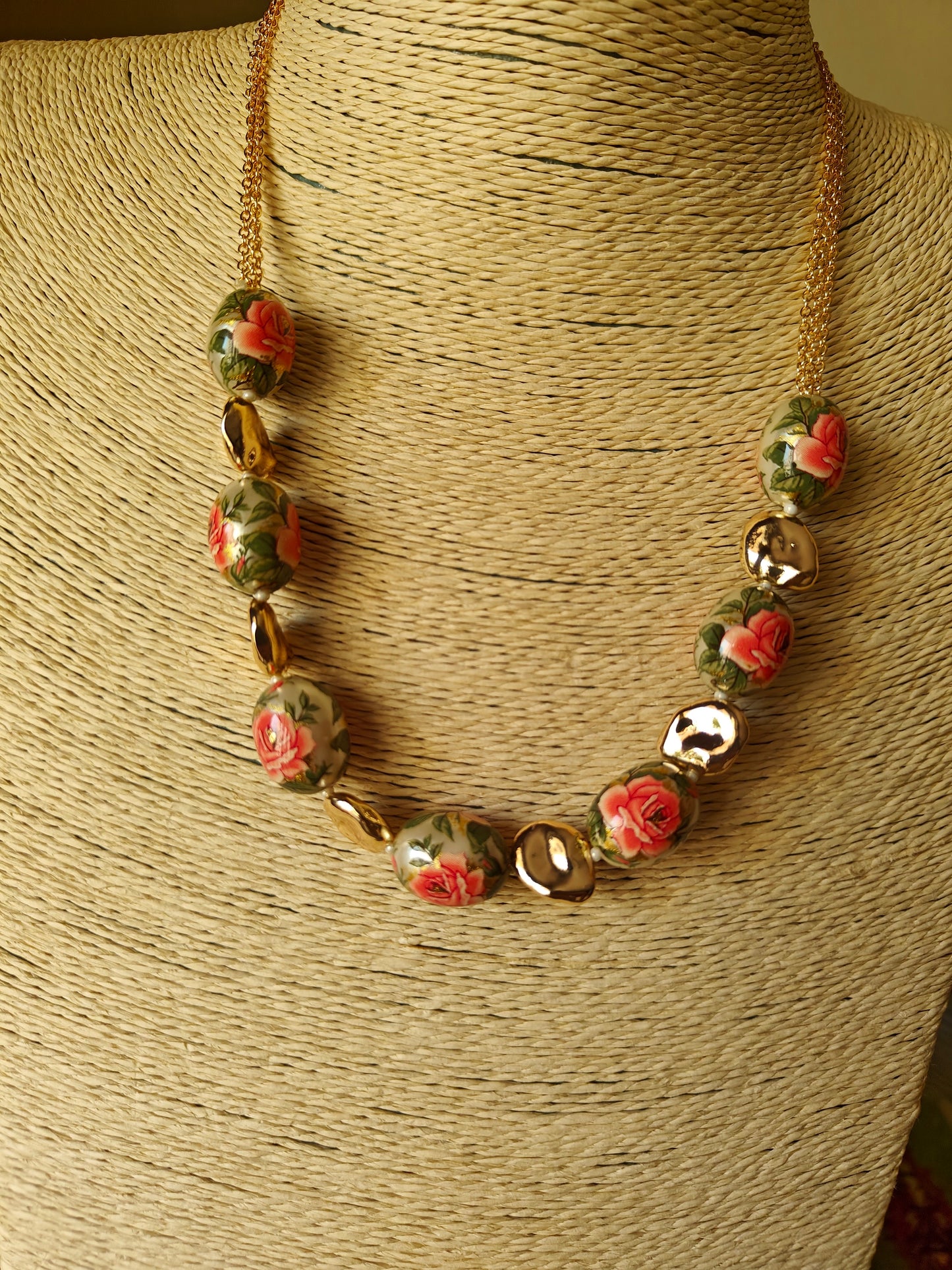 Meenakari painted beads set with flowers and twig design on them