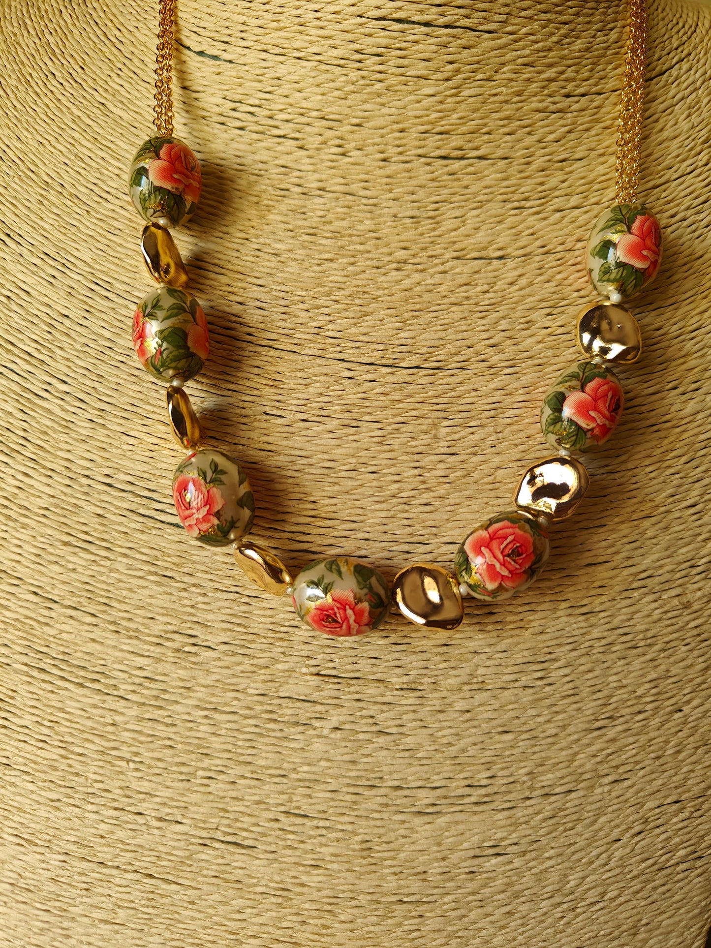 Meenakari painted beads set with flowers and twig design on them