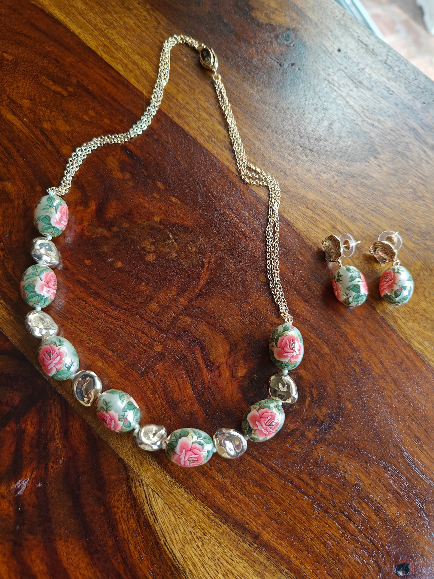 Meenakari painted beads set with flowers and twig design on them