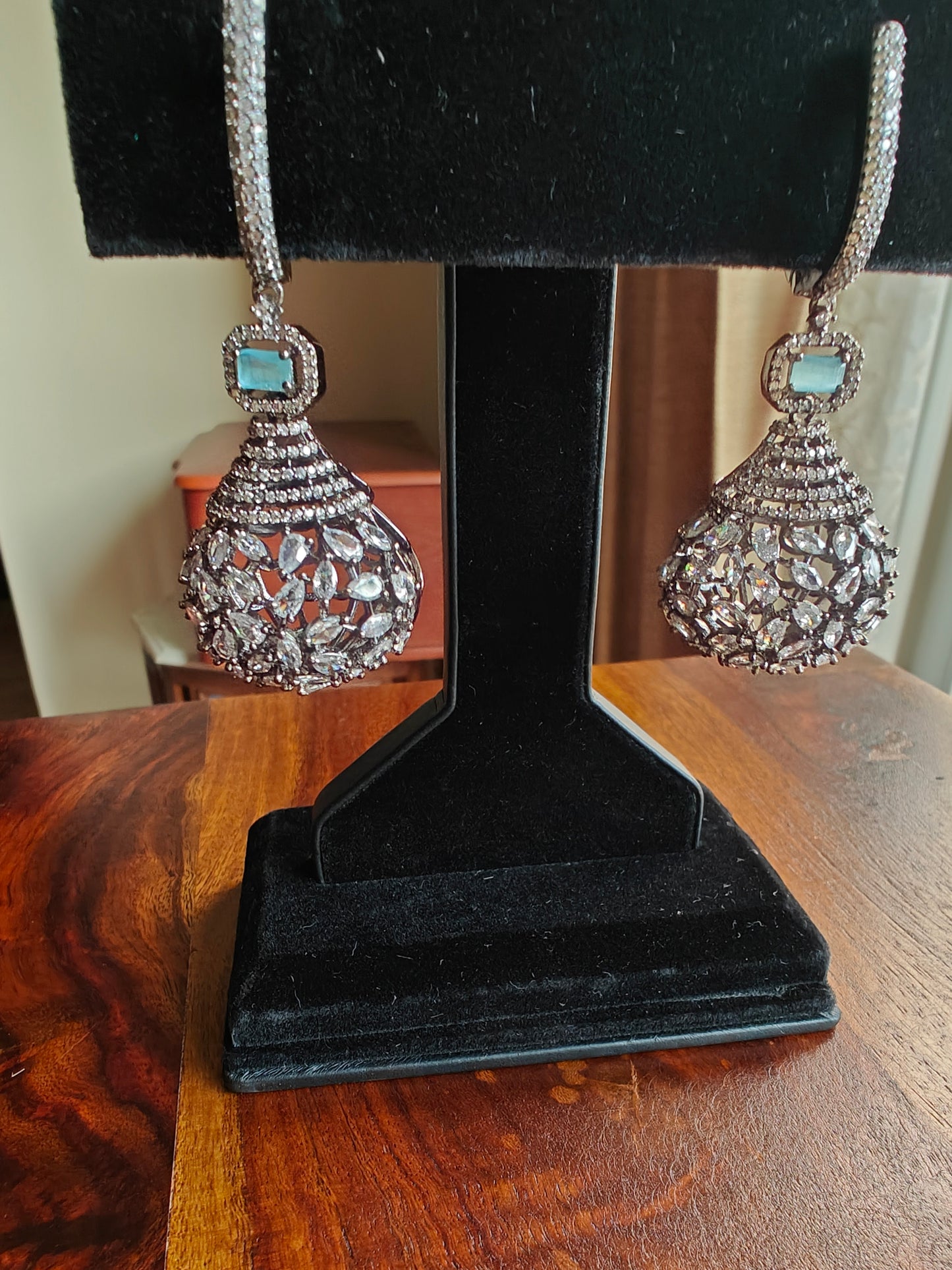 Earrings in antique platinum finish with a big hanging bulb design at the bottom.