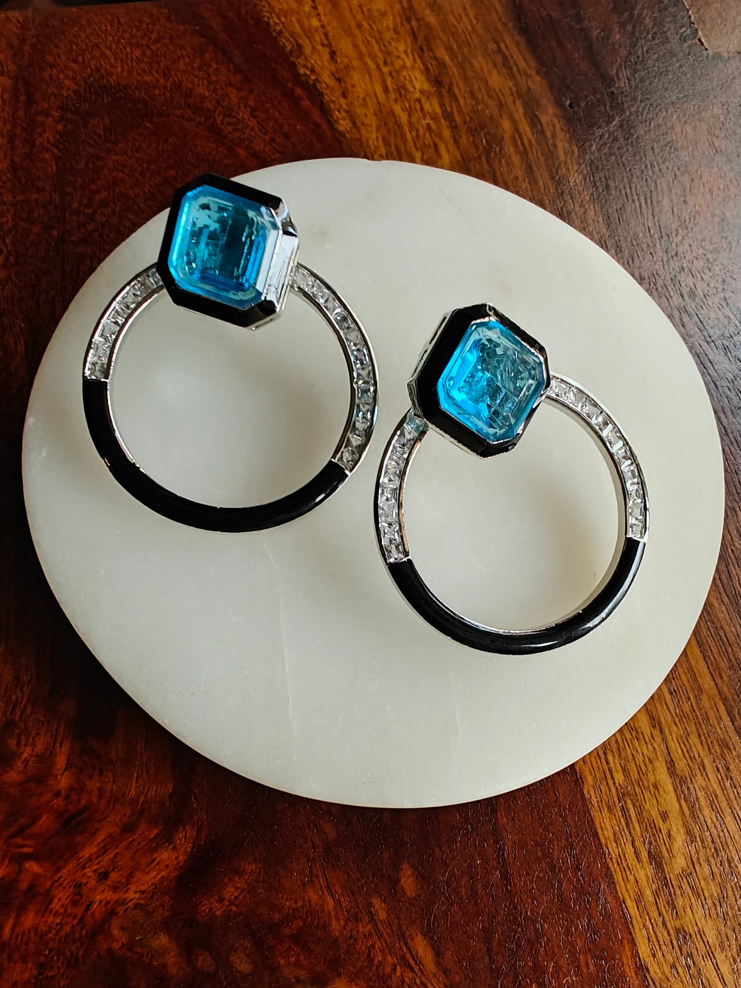 Hoops with aqua blue/green stone on top. Suds can be worn separately as well.