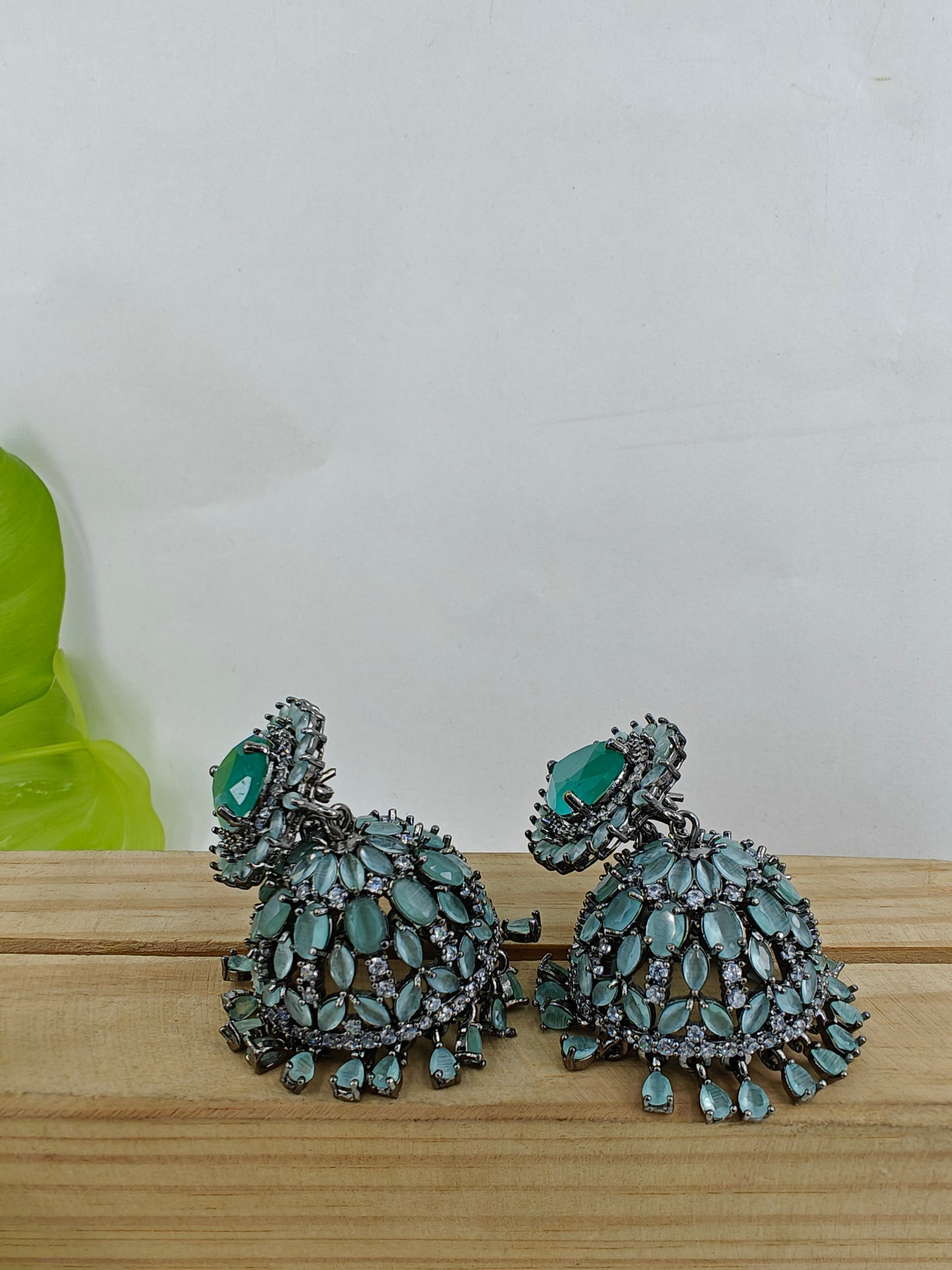 Chandelier jhumkas in mint green/champagne colour