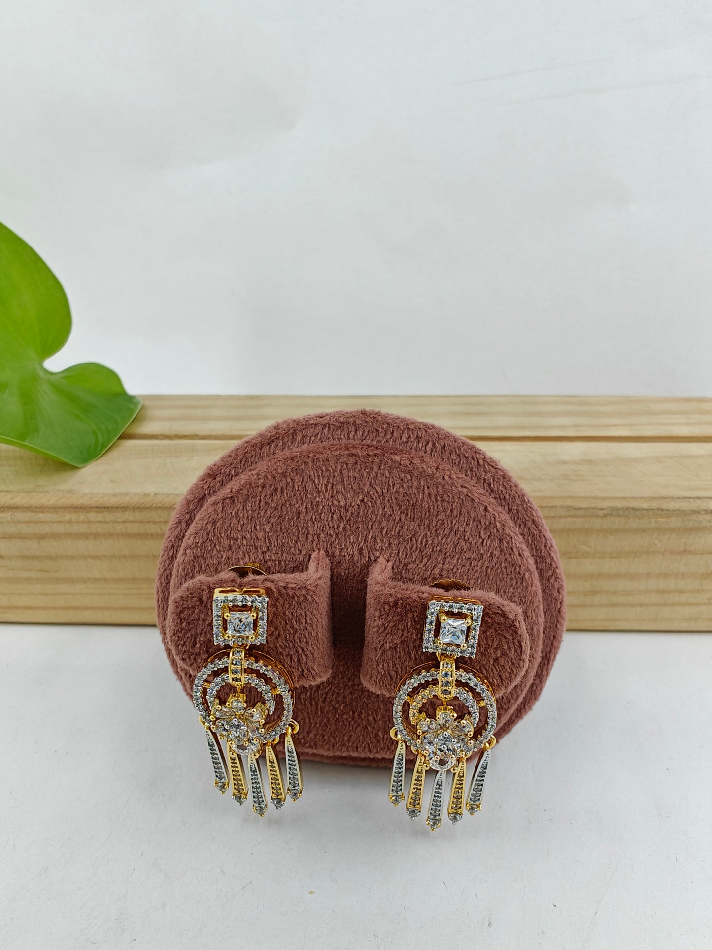 Earrings with hangings below square CZ stud