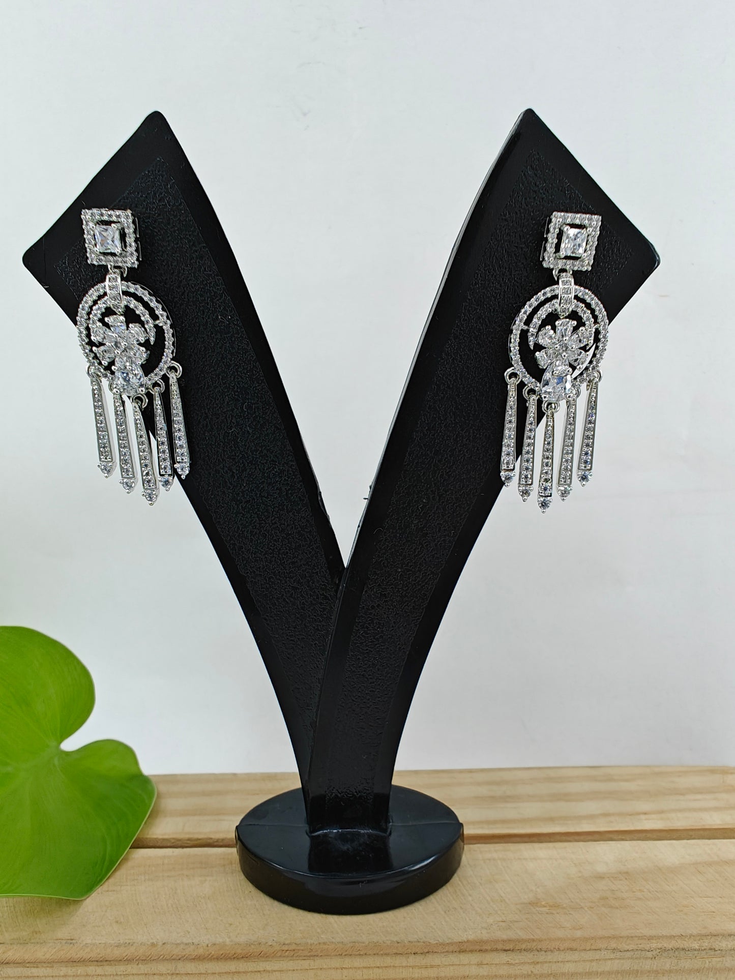 Earrings with hangings below square CZ stud