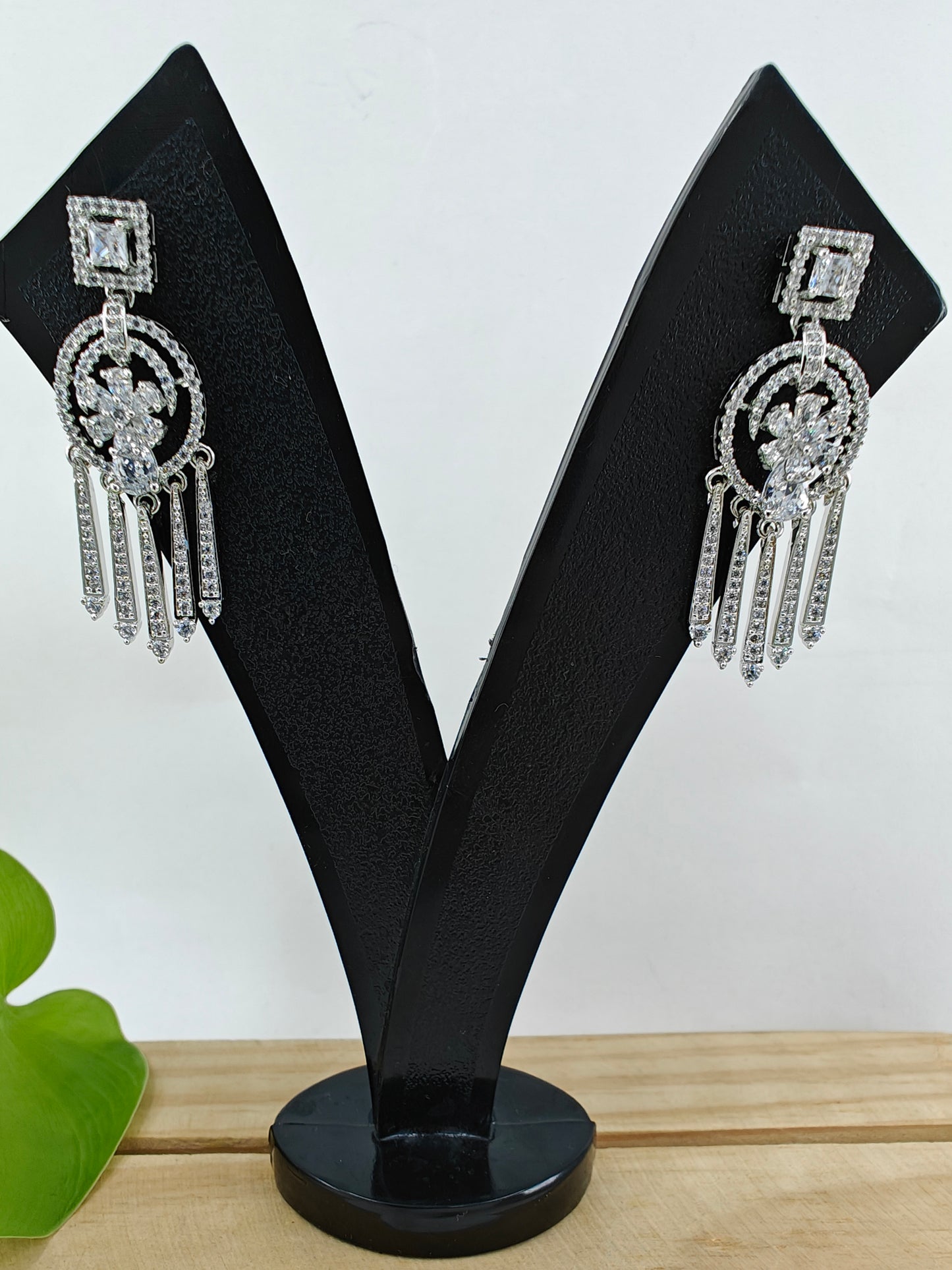 Earrings with hangings below square CZ stud