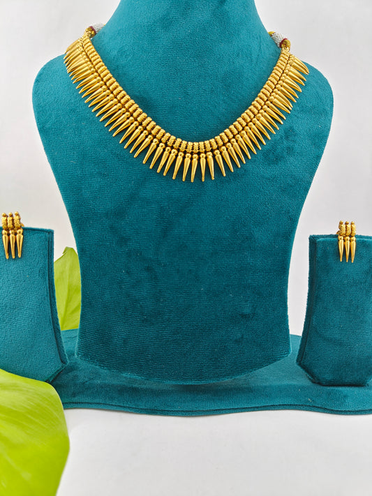 Gold finish set with spikes on the necklace and matching studs