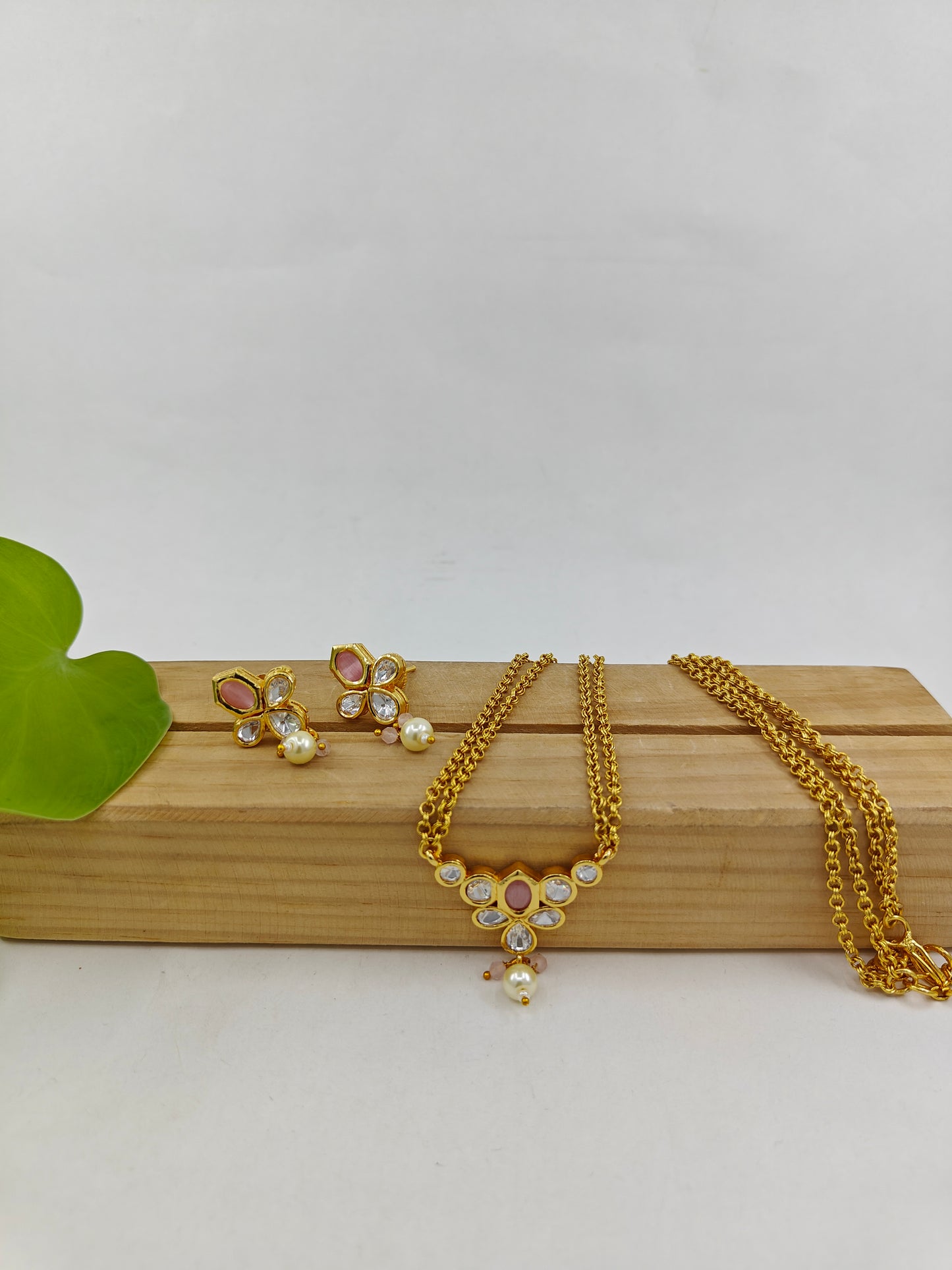 Set with kundan and mint green/baby pink pendant on double gold chains