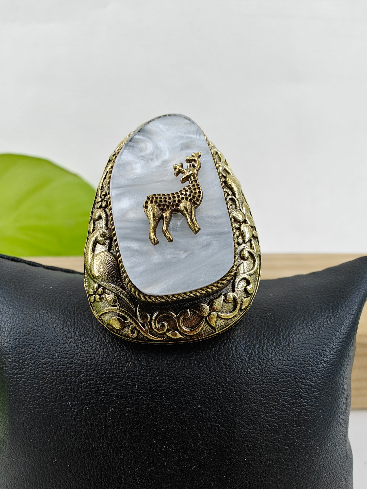 Ring with mother of pearl inlay with reindeer on top