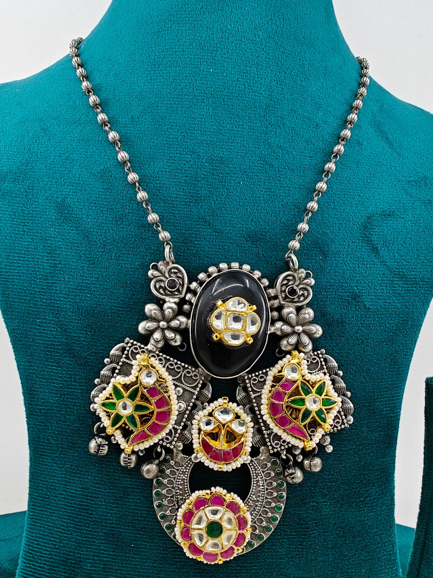 Necklace with a big pendant with stonework ,kundan and pearls