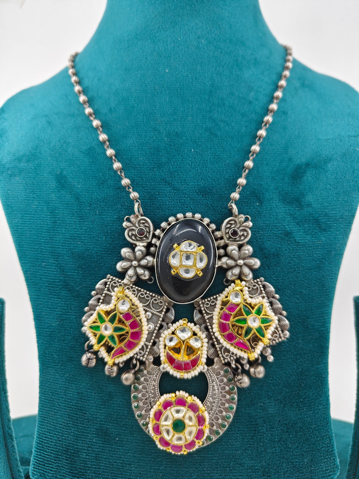 Necklace with a big pendant with stonework ,kundan and pearls