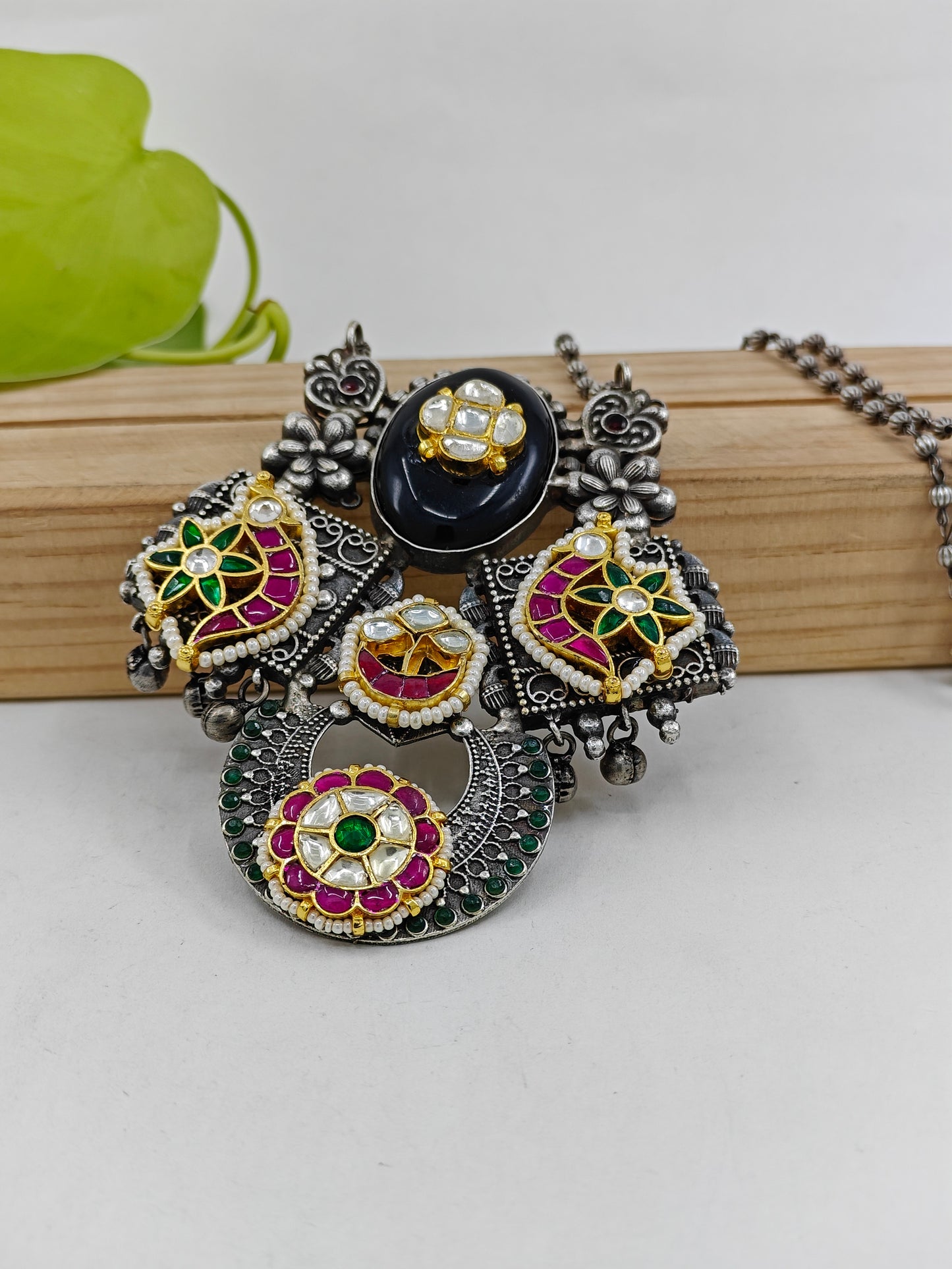 Necklace with a big pendant with stonework ,kundan and pearls