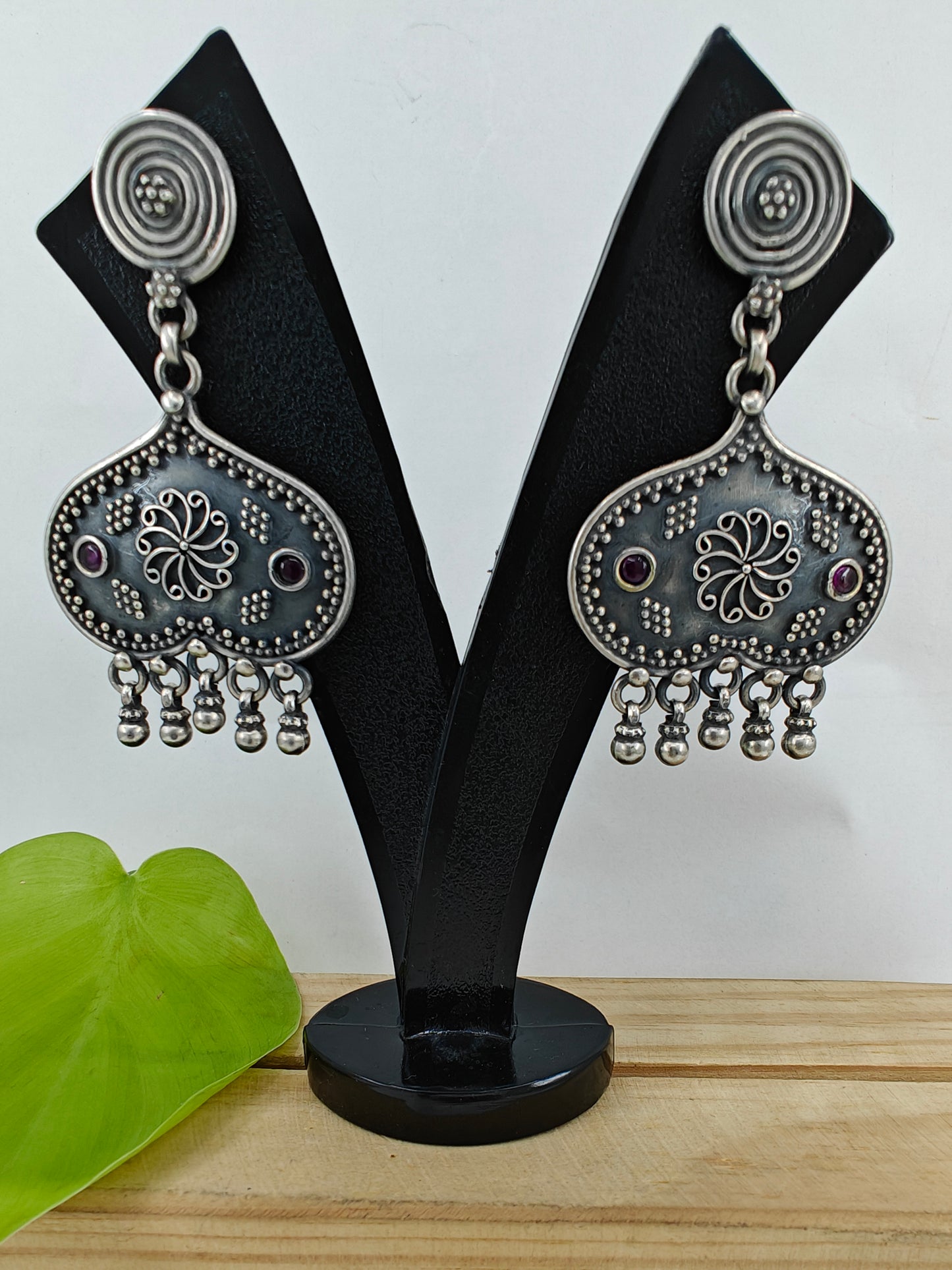 Silver earrings with an inverted heart shaped design