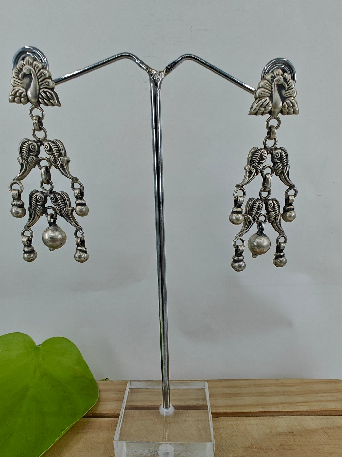 Silver earrings with multiple peacocks