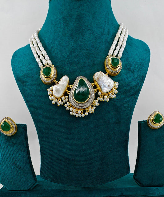 Baraque pearls and emerald green stone set