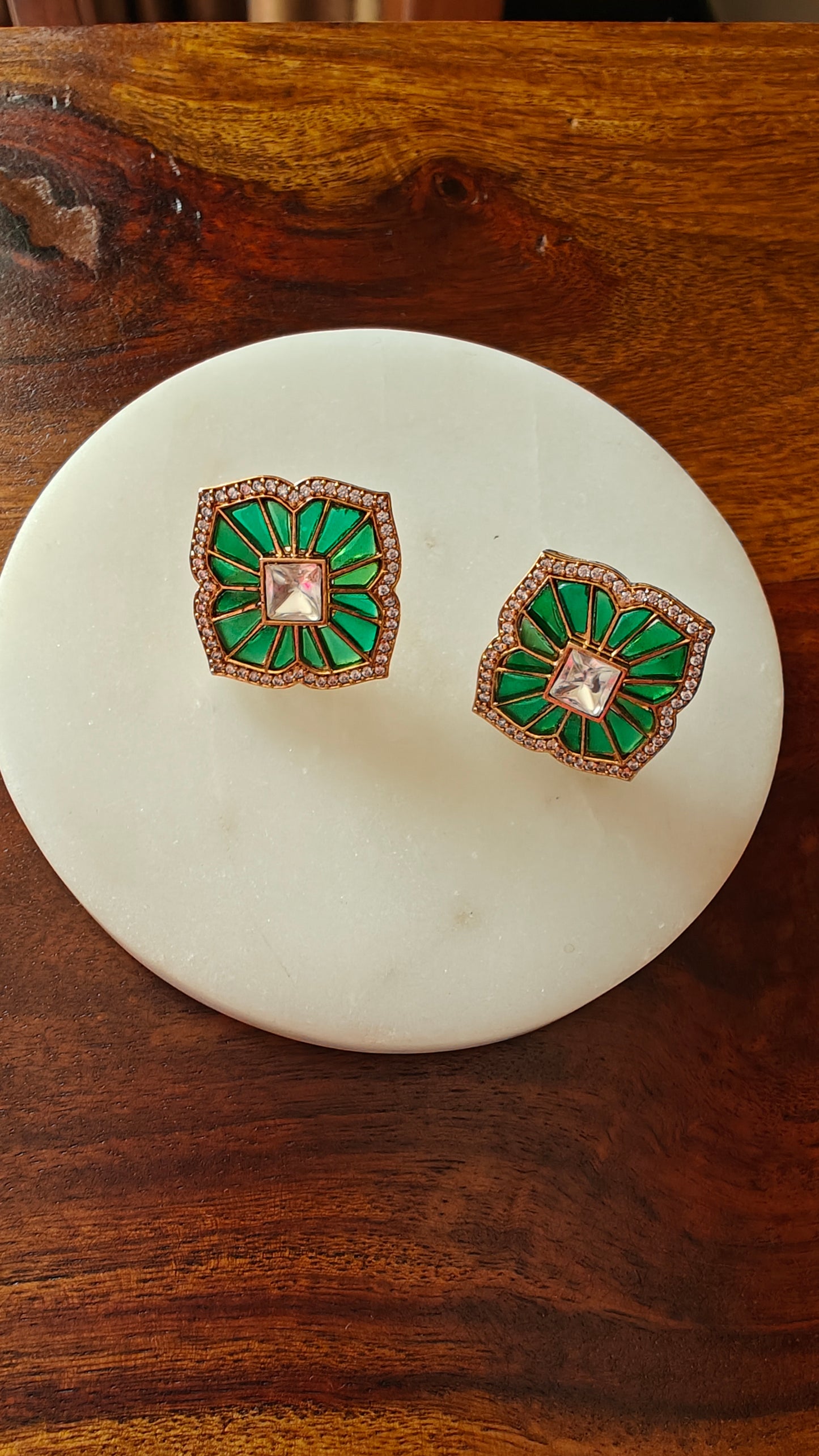 Green stone inlay studs (earrings) with golden spike work on stone