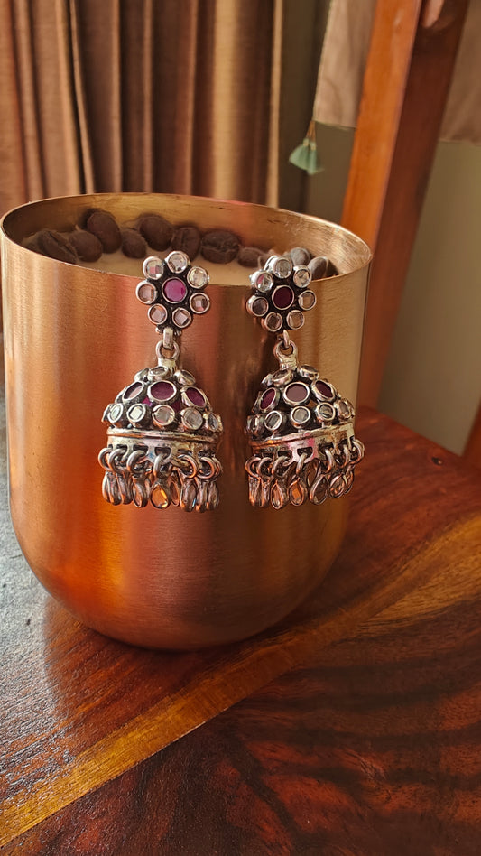 Silver jhumkis (earrings) with red and white stones