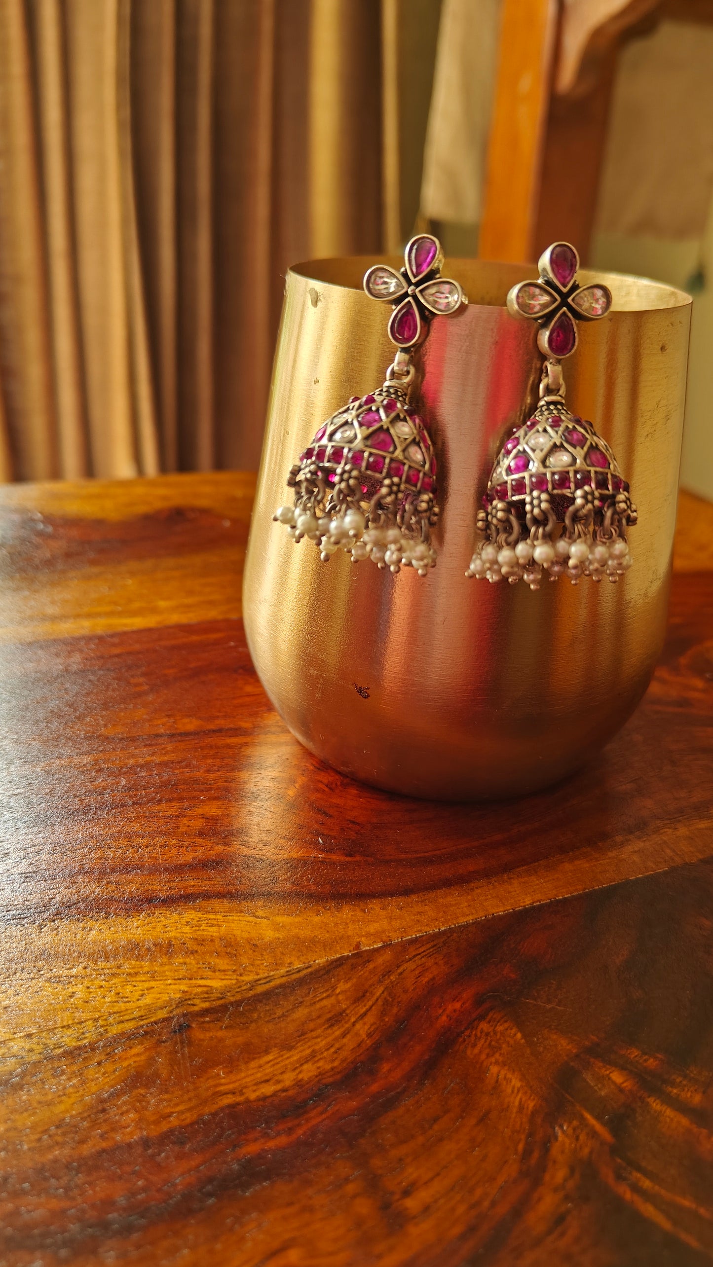 Antique silver jhumkas (earrings) with red and white stones