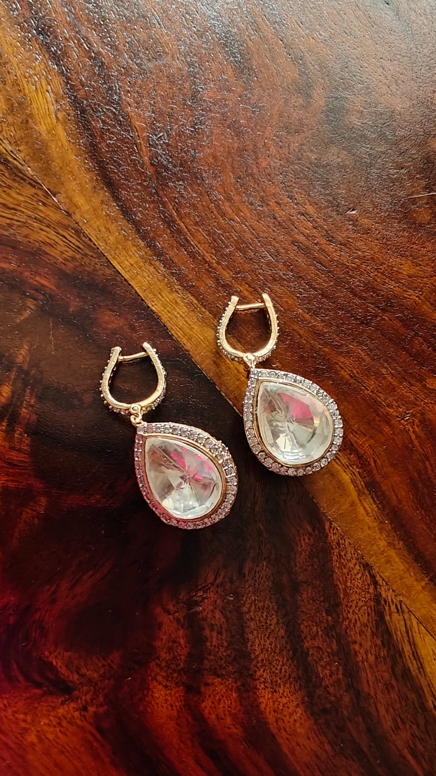 Reversible earrings with kundan on one side and CZ in jali work on other