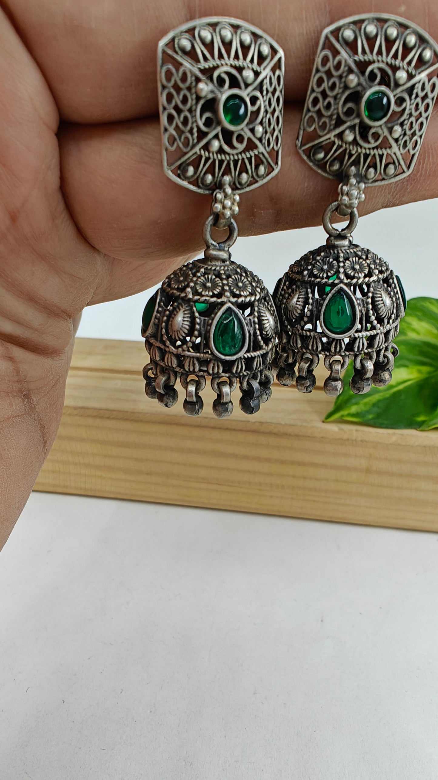 Jharokha silver earrings with emerald stone inlay