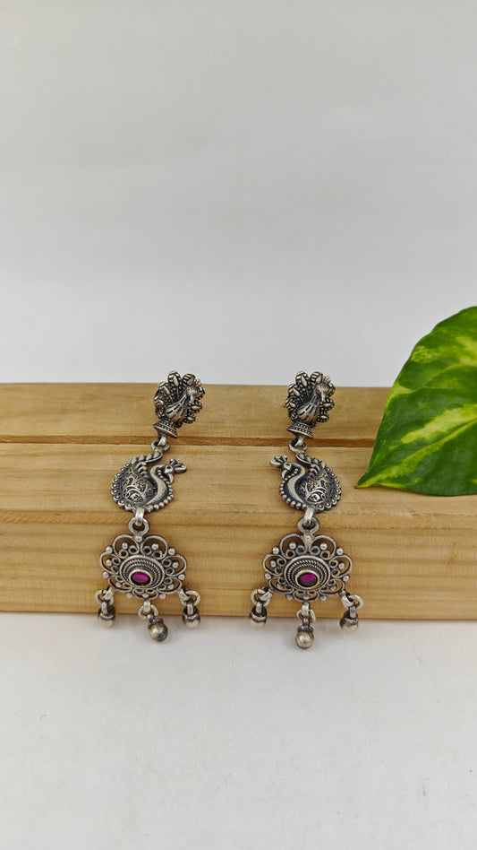 Silver earrings with a open peacock stud and bead hangings below