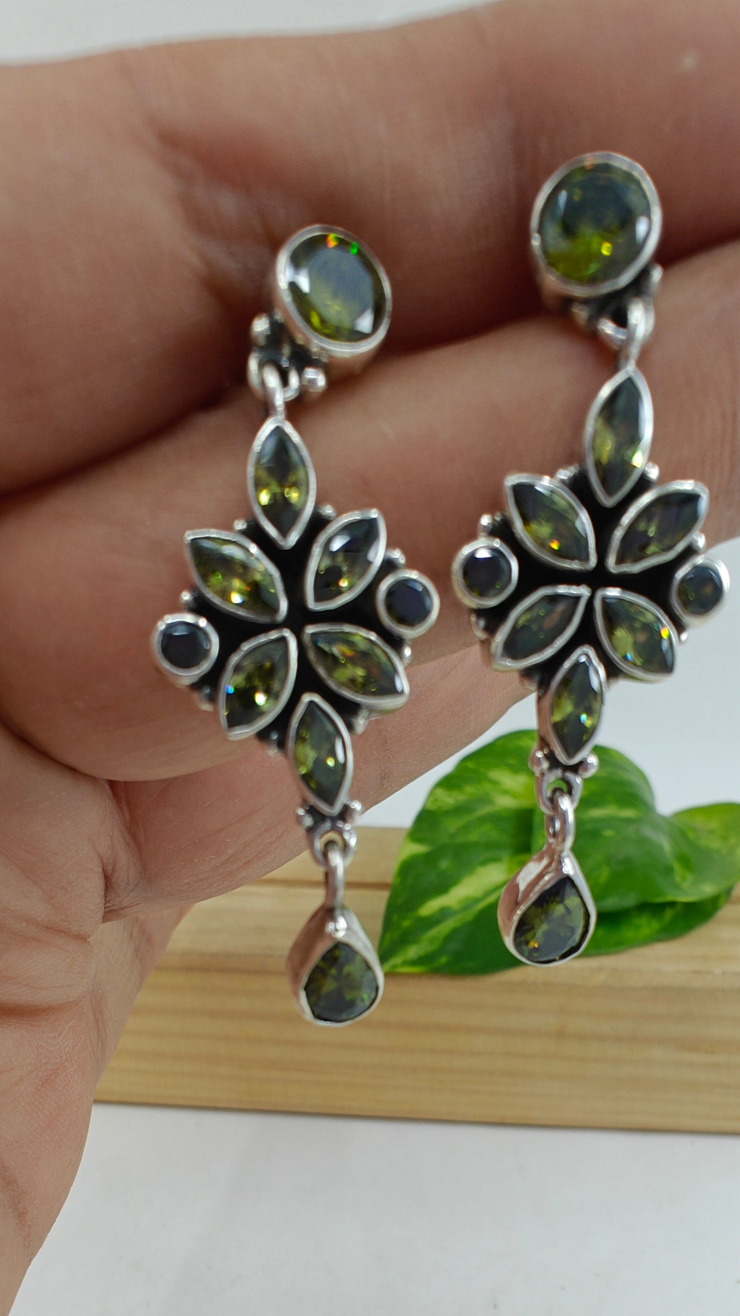 Silver earrings with stone inlay in purple/ green cyrstals