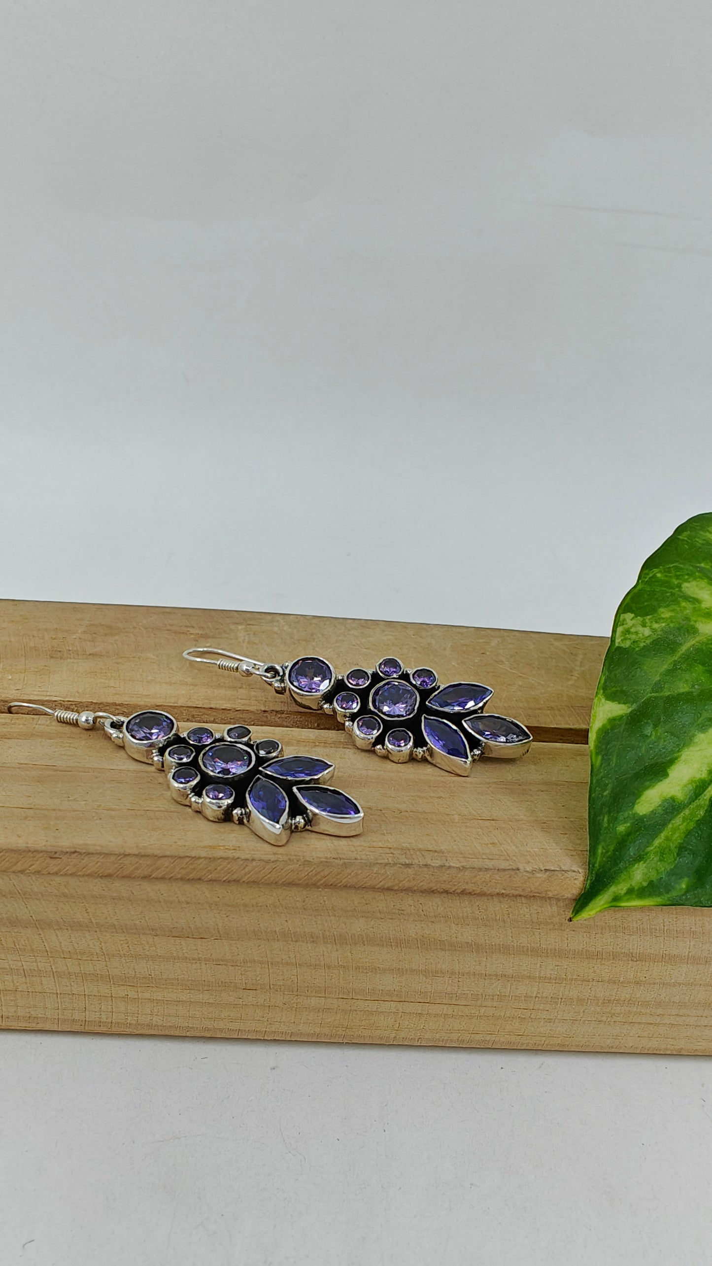 Silver earrings with stone inlay in purple/ green cyrstals