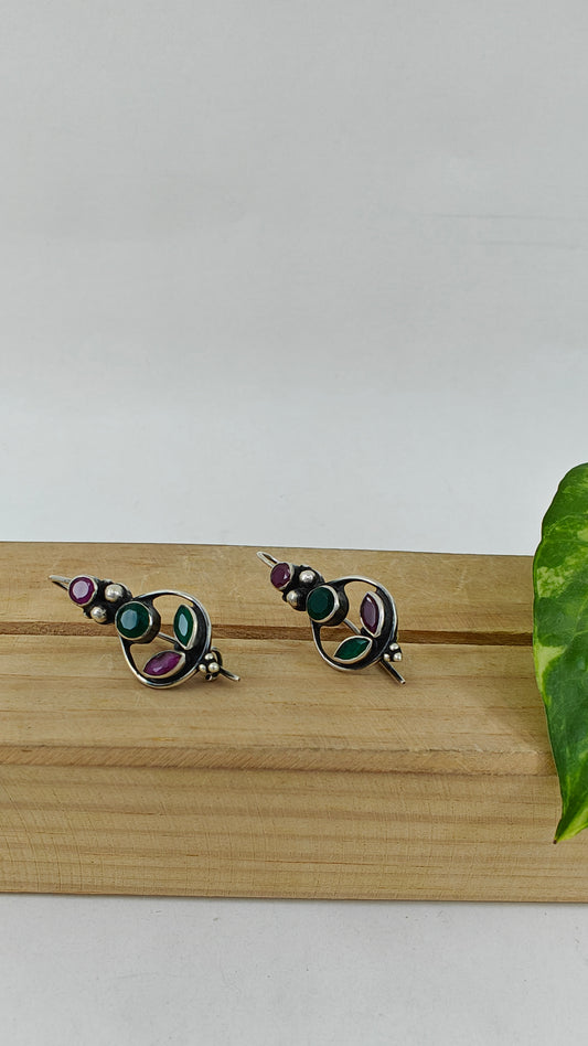 Silver earrings with red and green stones