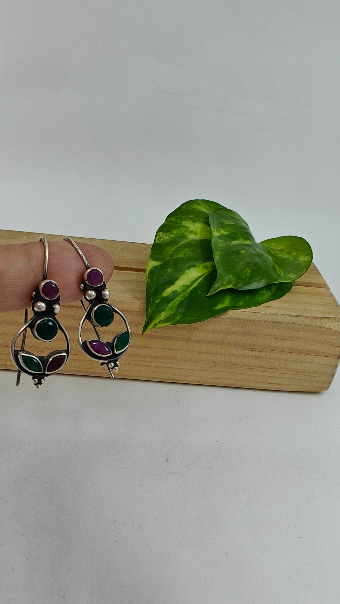 Silver earrings with red and green stones