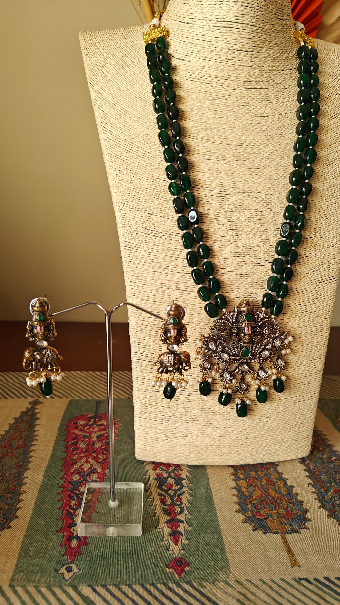 Venkateshwar set with emerald green stones