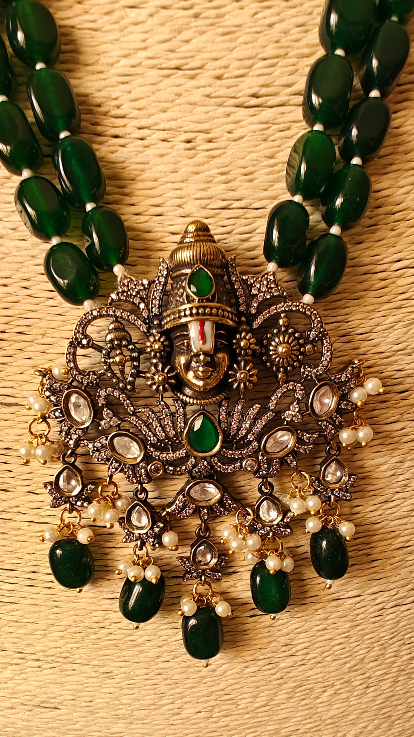 Venkateshwar set with emerald green stones