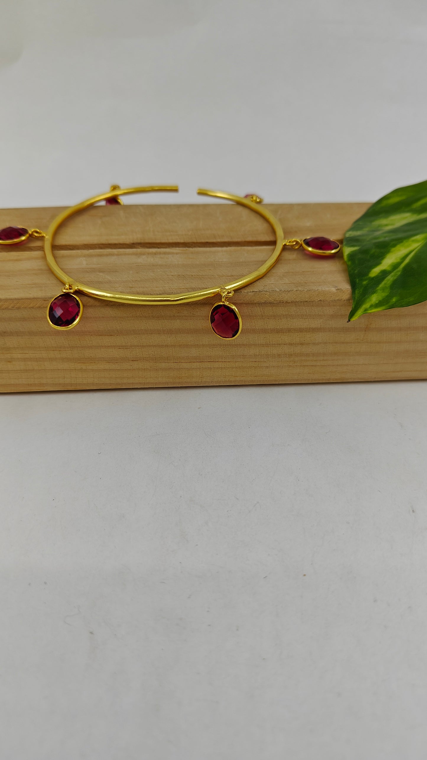 Bangle with stone hangings