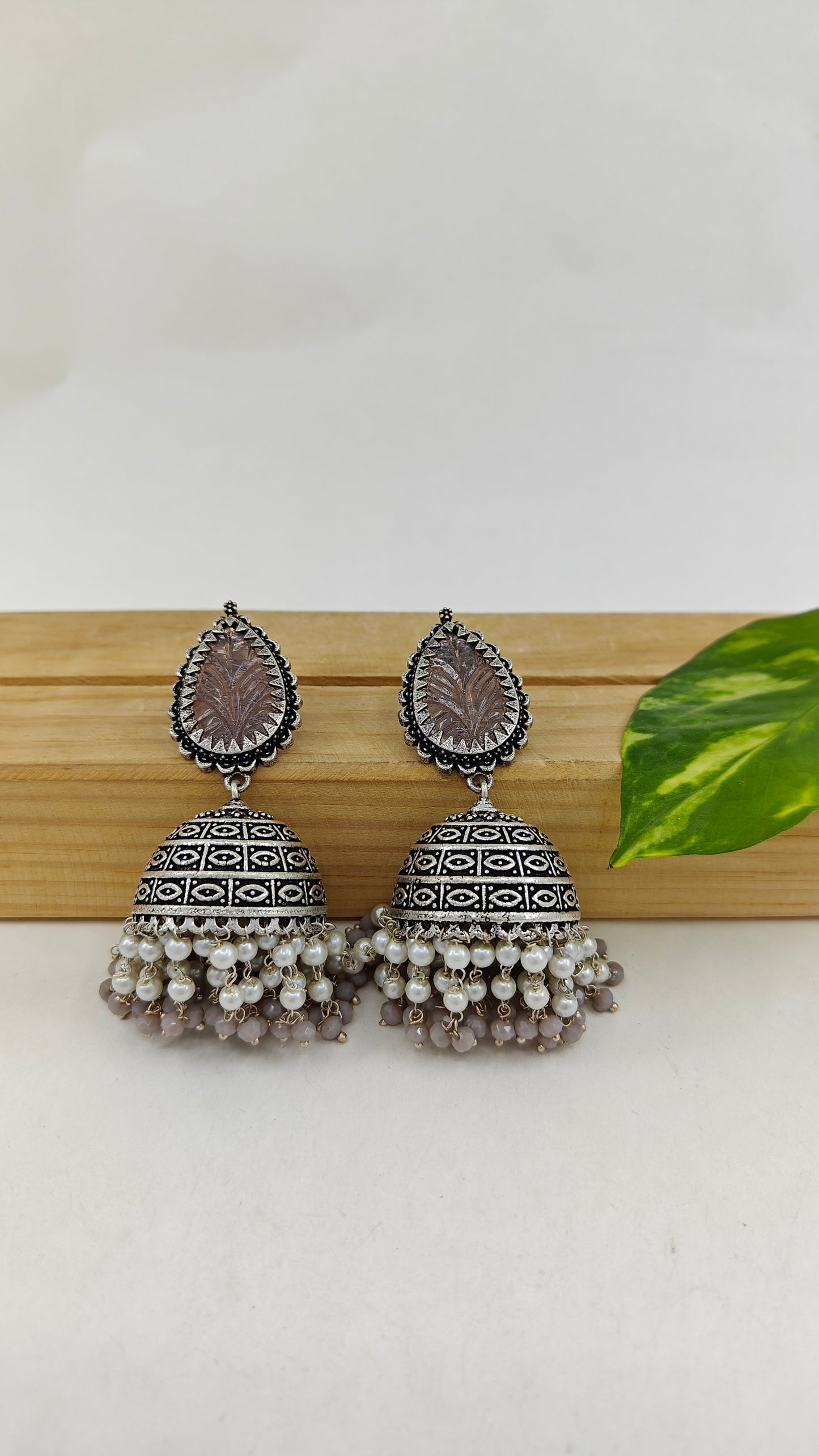 Silver finish jhumkas(earrings)with pearl and coloured stone hangings