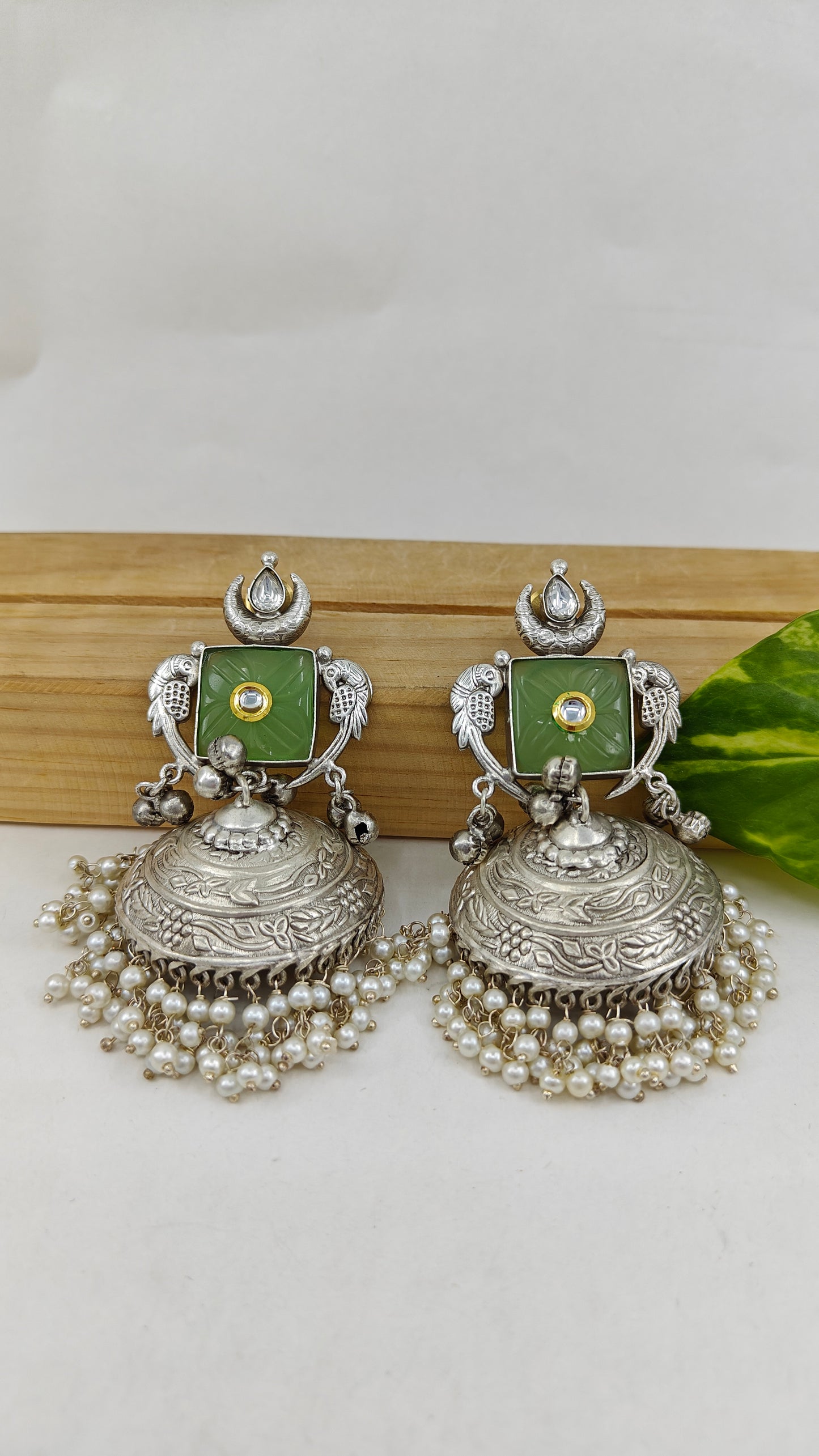 Nazin jhumkas with mint green stone and kundan