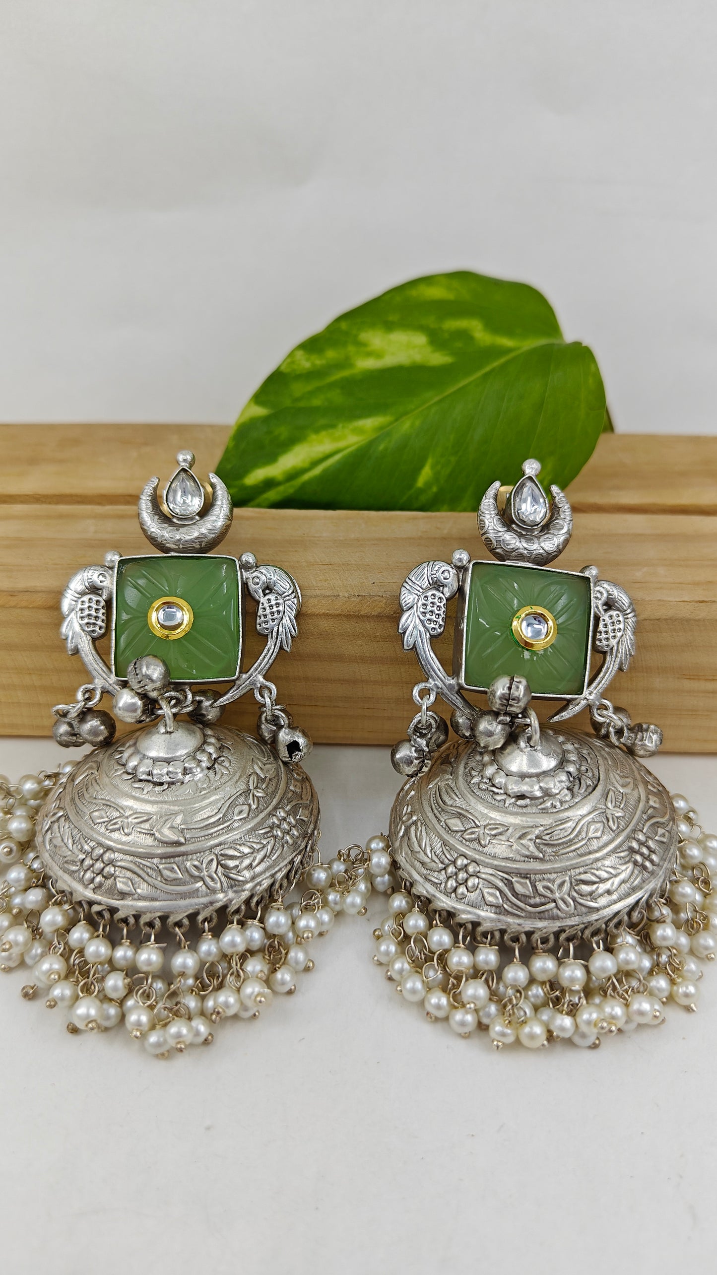 Nazin jhumkas with mint green stone and kundan