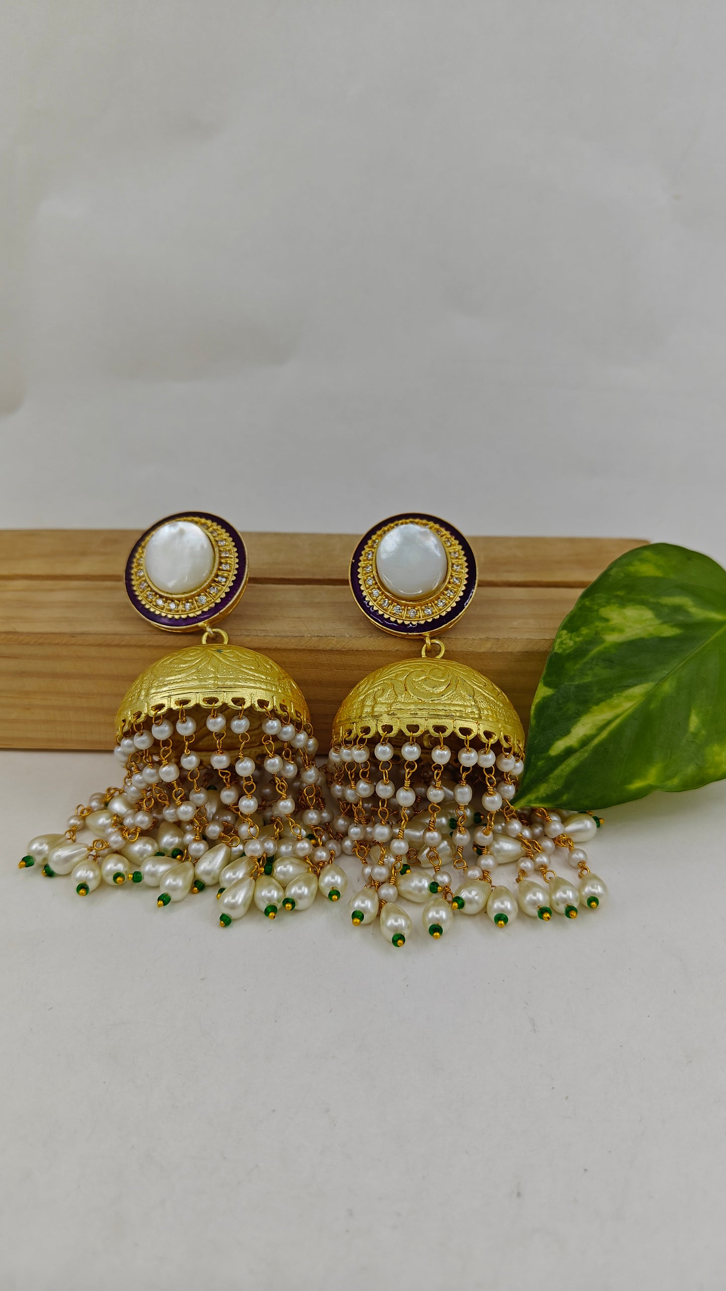 Golden jhumkas with Long pearl hangings