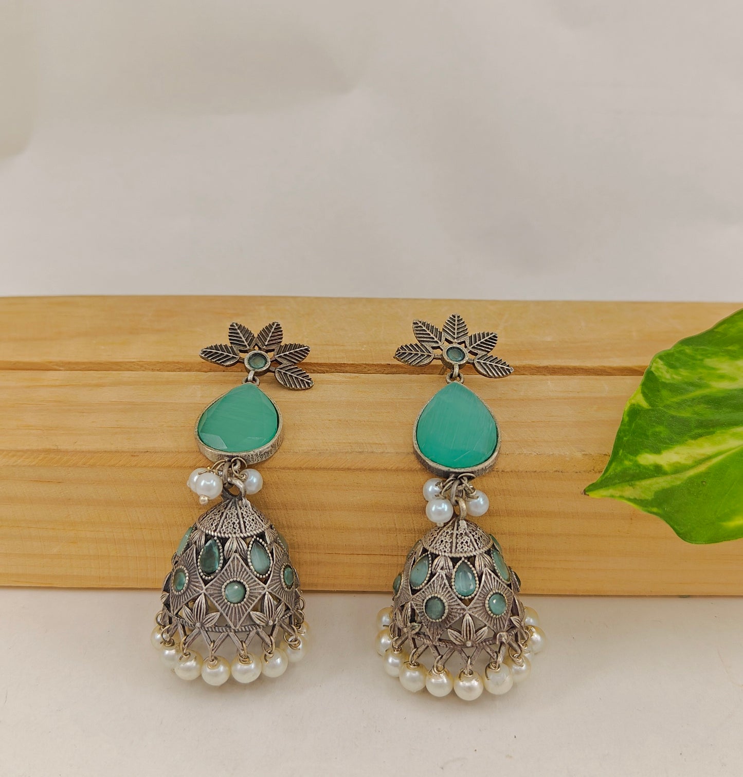 Jhumkis with mint green stone