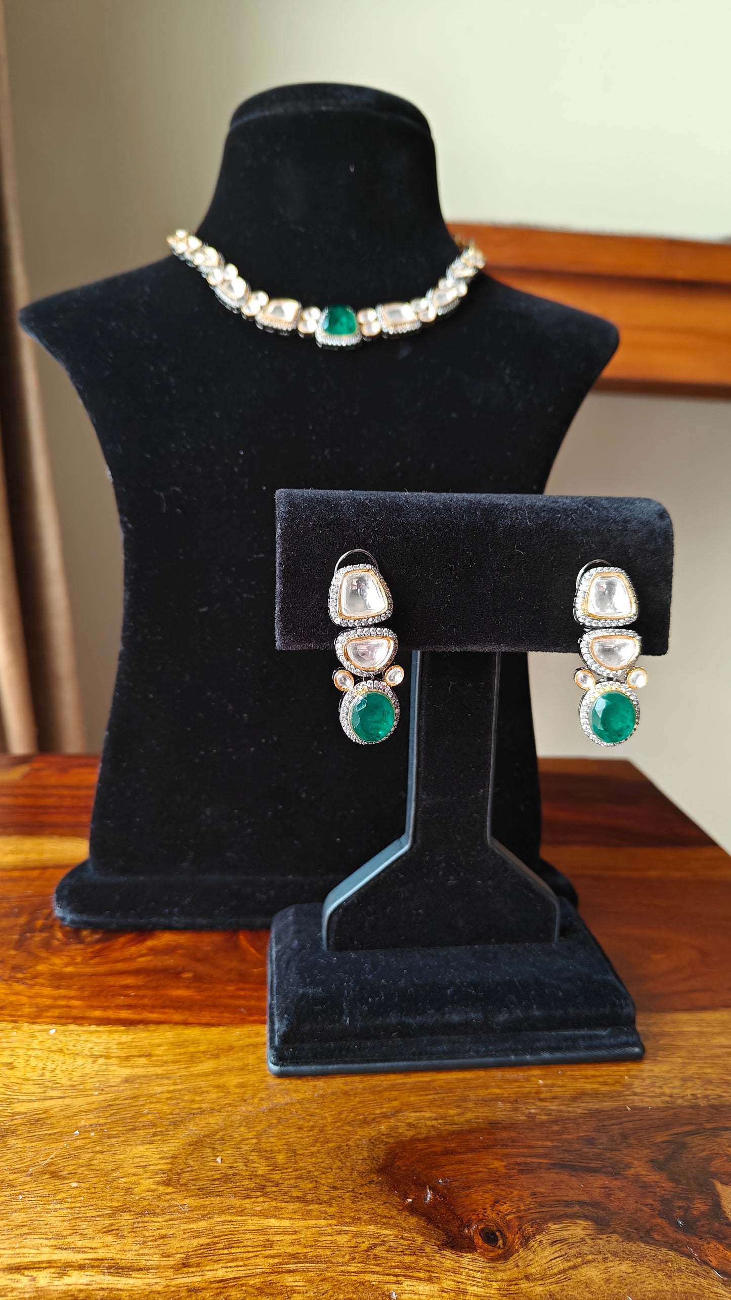 Eesha set in moissanite and emerald green stone