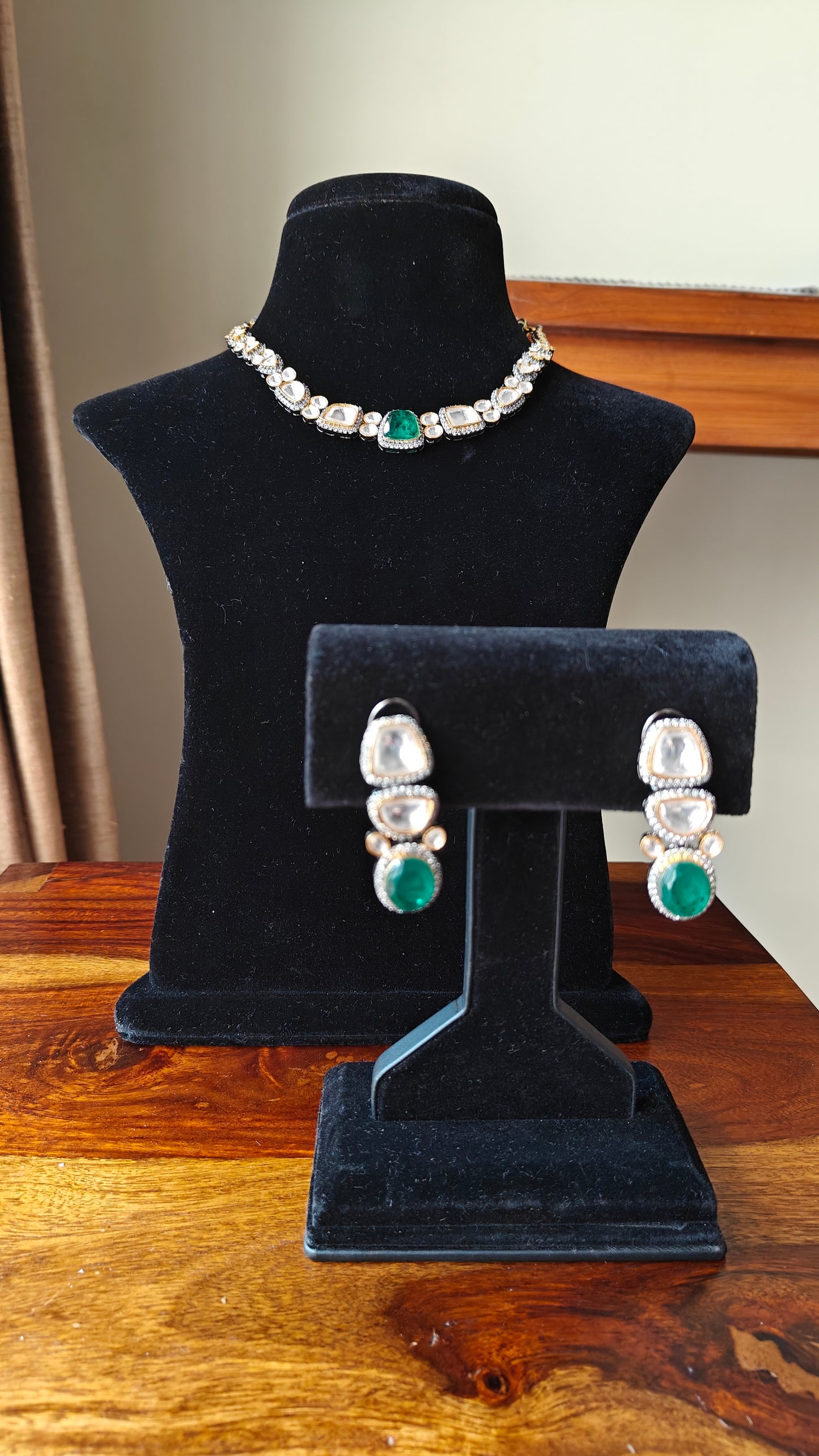 Eesha set in moissanite and emerald green stone