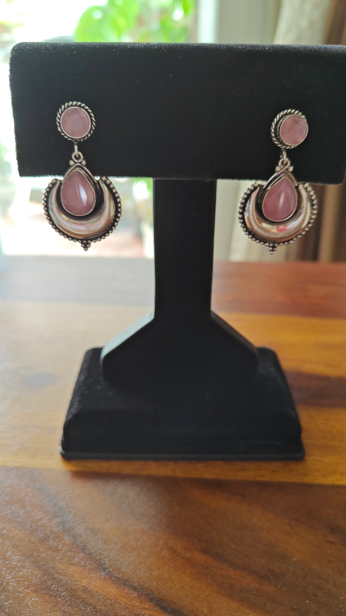 Teardrop stone hanging on stone stud