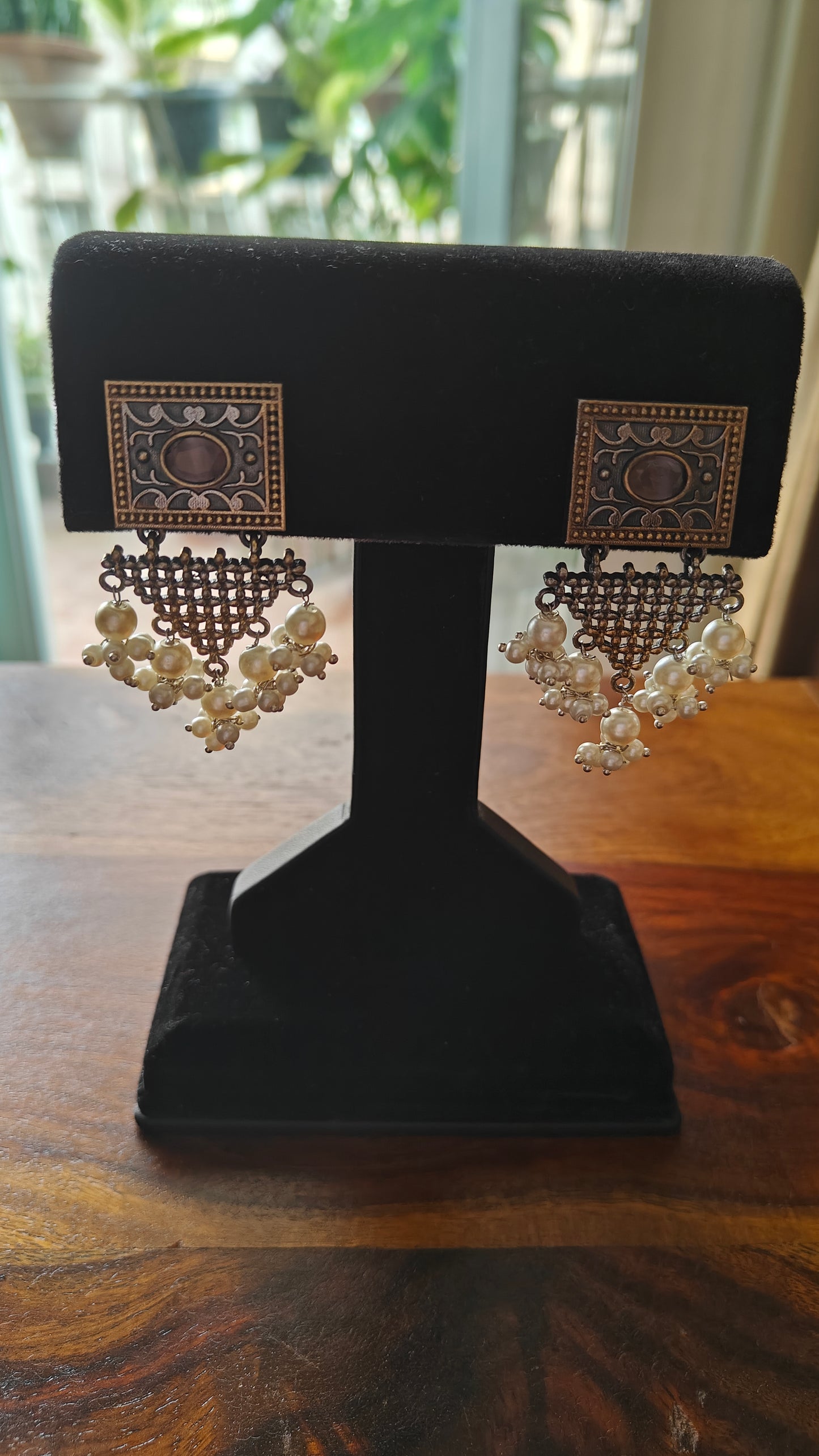 Earrings in dual tone with triangular hangings with pearls